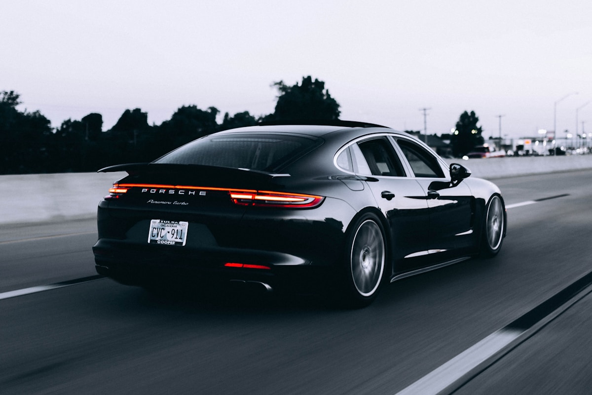 Modern sports coupe on mountain highway