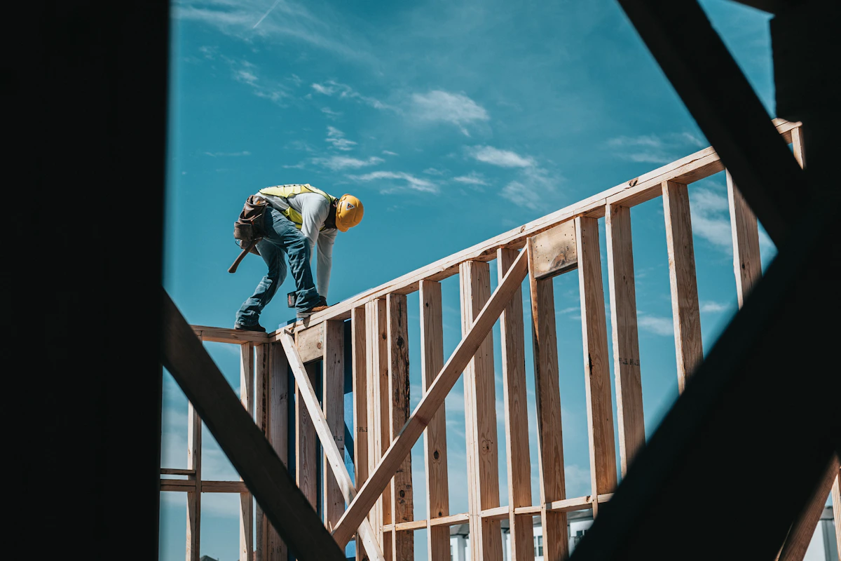 New residential building under construction with exposed structural timber framing