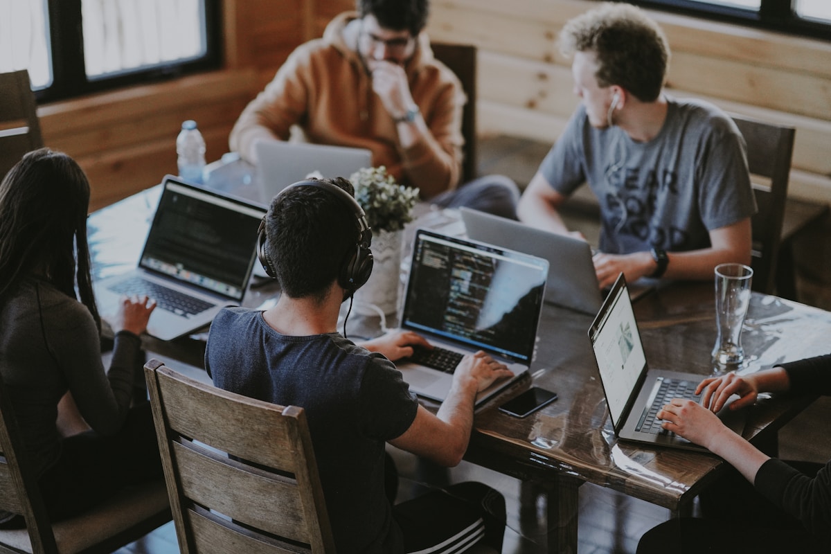 Employees and business team collaborating safely in modern workplace